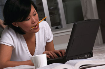 Woman on home computer - Home IT consulting services for your home network issues